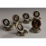 A set of six George V silver, tortoiseshell and pique menu holders,