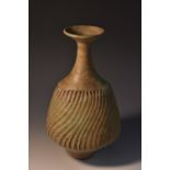 Dame Lucie Rie (Austrian, 1902-1995), a dolomite glaze bottle vase, wrythen fluted,