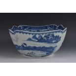 A Chinese shaped square punch bowl, painted in underglaze blue with figures in landscapes,