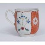 A Worcester Scarlet Japan pattern coffee cup, painted with alternating flowers,