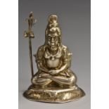 An Indian silver model, of a goddess, seated in a lotus, her status staff by her side, 6.