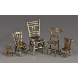 A Continental silver toy miniature model, of a Victorian kitchen chair, 3.