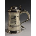 A small George II silver cylindrical tankard, hinged domed cover with scroll thumbpiece,