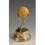 Golf - a George V silver 'hole-in-one' trophy, the ball supported on three crossed clubs,