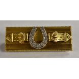 A diamond horseshoe and belt buckle brooch,