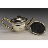 A George III silver oval teapot and stand, domed flush-hinged cover, straight spout,