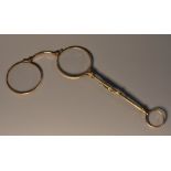 A pair of late 19th century lady's yellow metal lorgnette,