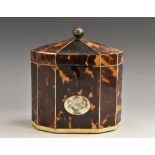 A George III decagon tortoiseshell tea caddy, ball finial, ivory banding, oval cartouche,13cm high,