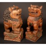 A large pair of temple entrance carved wooden Dogs of Fo,