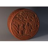 A Chinese cinnabar lacquer circular box and cover, carved in relief with an official and attendants,