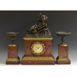 A 19th century French bronze, ormolu and rouge marble clock garniture, 9.