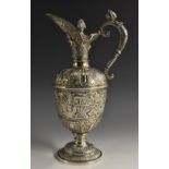 A Victorian silver Cellini ewer, cast and chased with masks, animals and floral bouquets,