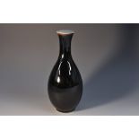 A Chinese monochrome black glazed bottle vase,