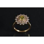 A fancy yellow and white diamond cluster ring, central vibrant yellow diamond approx 0.