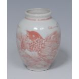 A Chinese miniature ovoid vase, painted in underglaze red with carp amongst rolling waves, 6.