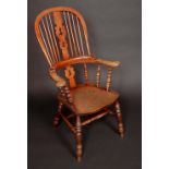 A 19th century elm Windsor elbow chair,