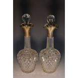 A pair of Victorian silver mounted hobnail-cut clear glass ovoid liqueur decanters,