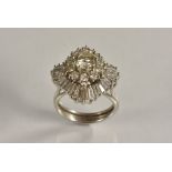 A diamond cluster ring, central round diamond approx 0.