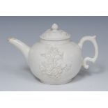 A Bow blanc de chine globular teapot, moulded in relief with blossoming prunus,