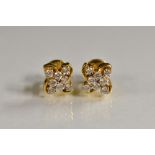 A pair of diamond eight stone cluster earrings,