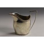 An early 19th century Dutch silver cream jug, of good gauge, beaded borders, angular scroll handle,