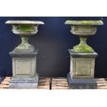A pair of Regency design composition saucer-shaped garden urns,
