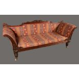 A post-Regency rosewood sofa, shaped cresting rail and scroll ends carved with acanthus,