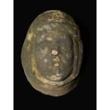 A Medieval limestone corbel, carved as the head of a lady, 27cm high, 28cm deep,