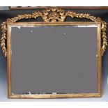 A 19th century Italian Rococo Revival giltwood and gesso over mantel looking-glass,