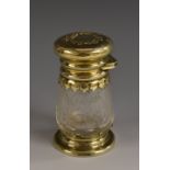 A Victorian silver-gilt and cut-glass smelling salts bottle,