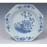 An 18th century Chinese porcelain octagonal dish, the centre painted with peonies,