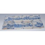 Eight Dutch Delft tiles, decorated in blue, stylised dragonfly, village church, swan,