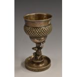 A Continental silver goblet, the bowl supported by a scantily clad grape picker,