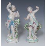 A pair of Derby Patch Mark figures, of Cupids, scantilly draped, before bocage,