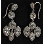 A pair of Art Deco diamond drop earrings, each set with sixty six round and navette cut diamonds,