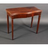 A George III mahogany serpentine card table,