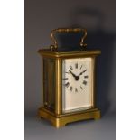 An early 20th century French lacquered brass carriage timepiece, 5.