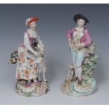 A pair of Derby Patch Mark figures, The Garland Shepherds, he wearing a broad brimmed black hat,
