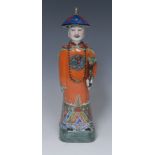 A Chinese figure, of an official holding a ruyi sceptre, 28cm high,