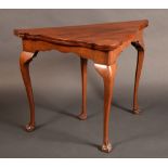 A George III design mahogany shaped tri-form card table, possibly Irish,