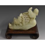 A Chinese jade group, of a cockerel, hen and chicks, by a basket, 13.