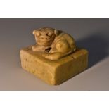 A Chinese soapstone seal, carved with a recumbent temple lion, 4.