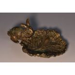 An Austrian cold painted bronze novelty trinket dish, as a rabbit beside an oversized cabbage leaf,