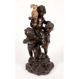A 19th century parcel-gilt and patinated gesso figure group, modelled as three Bacchic putti,
