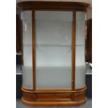 An early 20th century walnut display cabinet, ogee cornice,