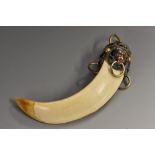 A 19th century Chinese enamel and white metal-mounted boar's tusk,