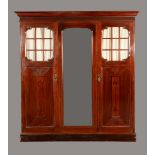 An Art Nouveau mahogany triple wardrobe,