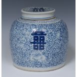 A Chinese ovoid ginger jar and cover, painted in tones of underglaze blue with symbols,