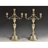 A pair of 19th century Austrian silver three-light table candelabra, urnular sconces,