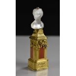 A 19th century rock crystal mounted seal/bonbonnière, carved as a classical maiden,